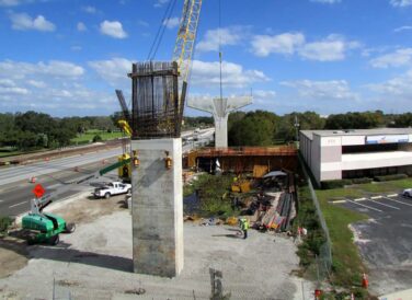 erecting bridge beams for Gateway Expressway