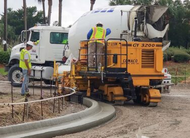 concrete truck and construction workers for US 98 widening