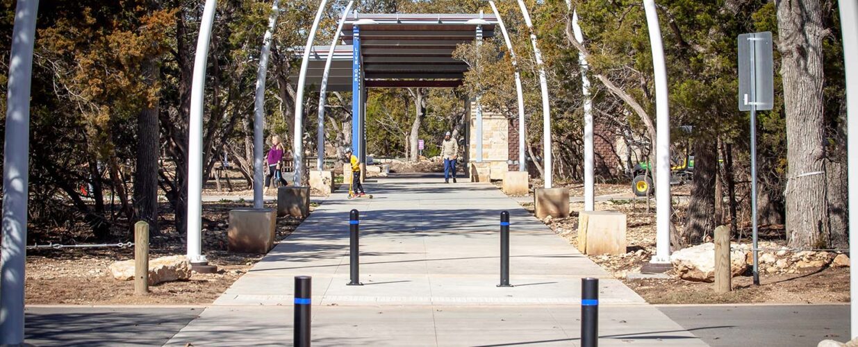 Leander Lake Park walkway with light poles