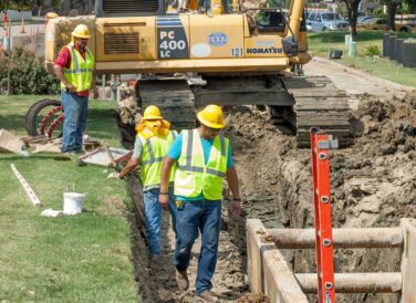 team working on dig site for Rochelle Blvd