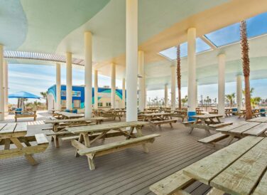 Isla Blanca Sandpiper Pavilion with wooden picnic tables