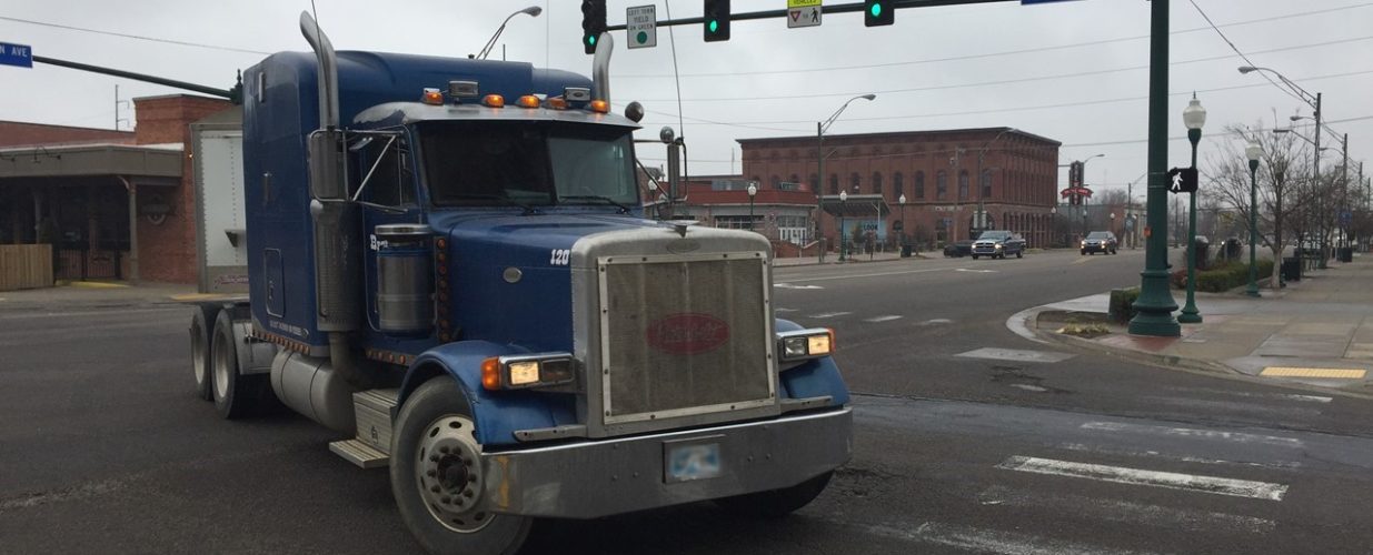 blue truck turning at Fort Smith downtown intersection