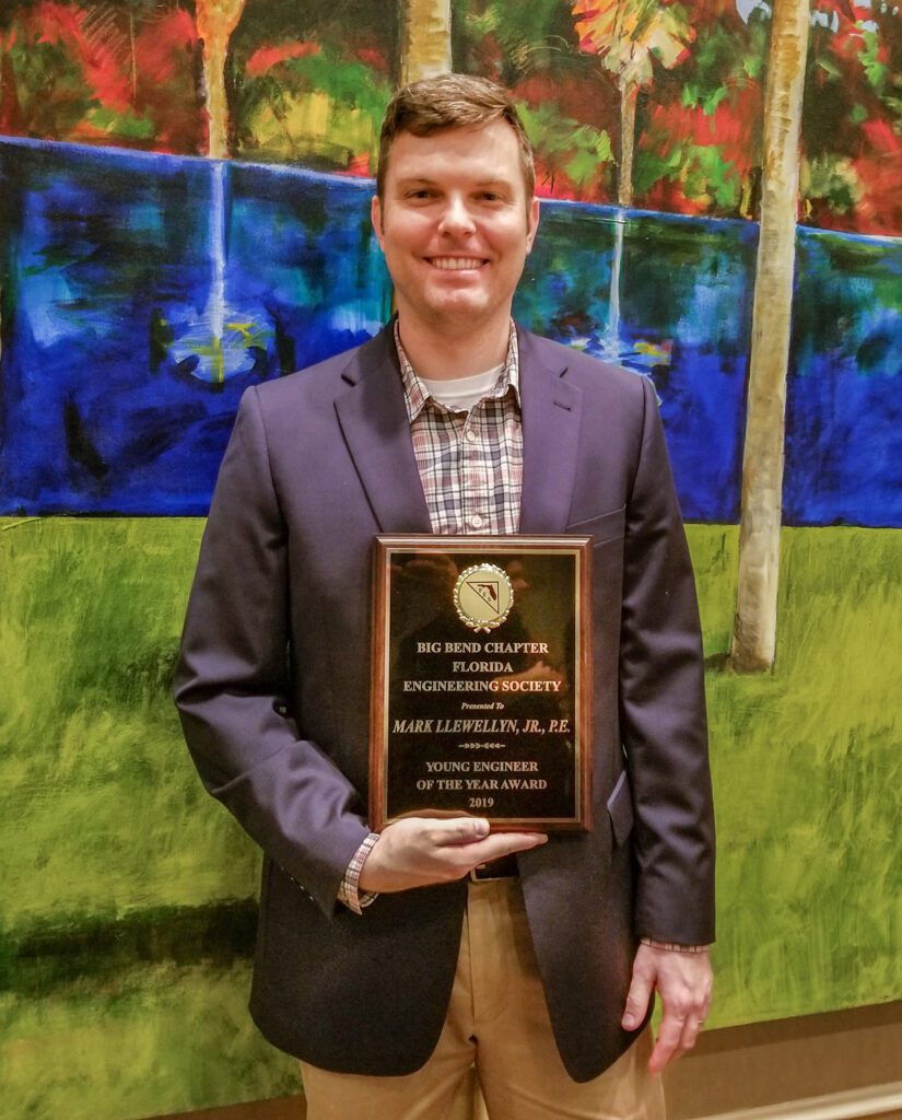 Mark Llewellyn Jr. with his FES award.