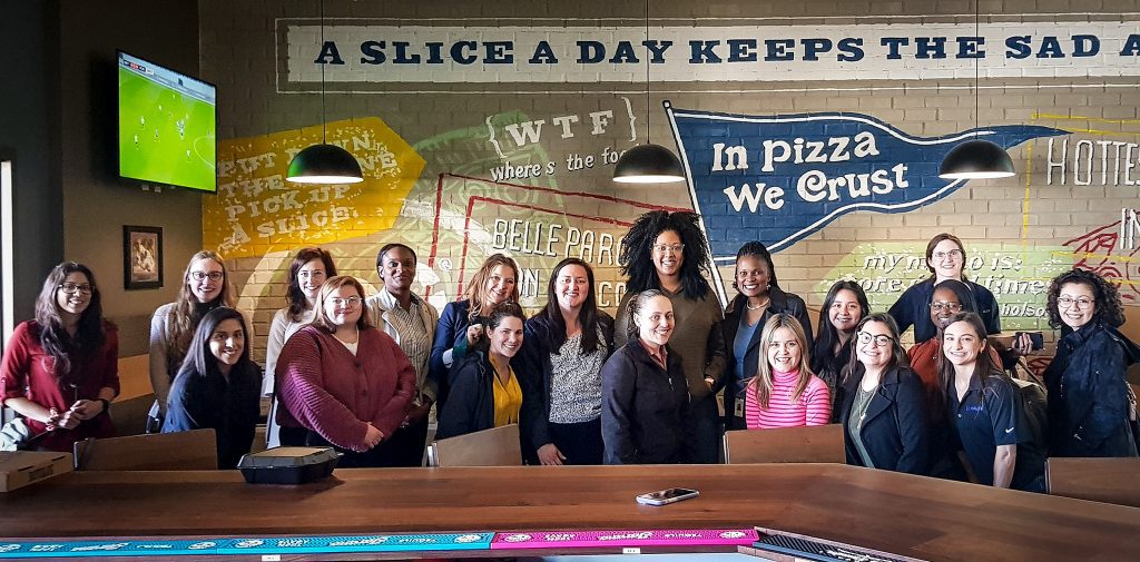 Group photo of Halff's Conroe and Houston office women at pizza restaurant