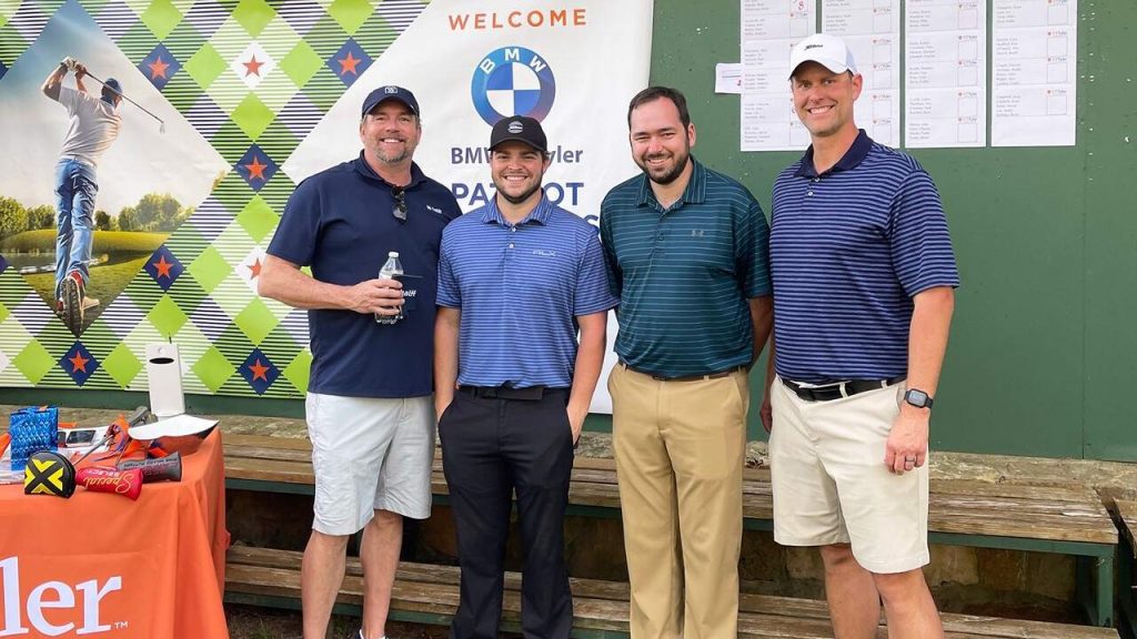 Four Tyler Halff employees at the Patriot Golf Classic tournament
