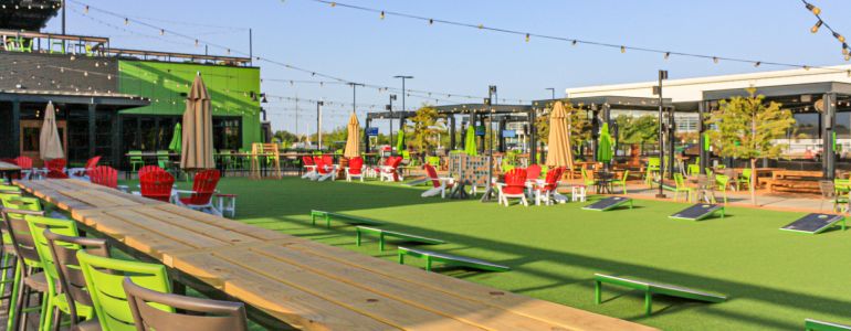 Outdoor courtyard at Chicken N Pickle in Grand Prairie, Texas