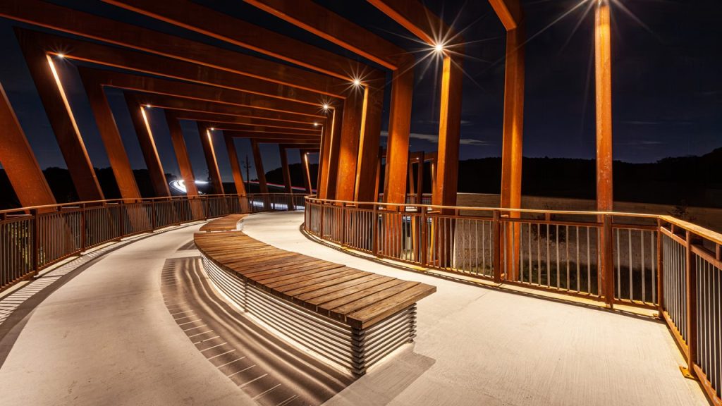 interior of trail overlook structure at night with lights