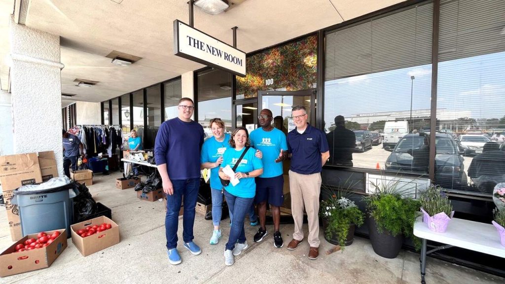 Halff employees Tyson Charlson and Keith Courson deliver donation to Feed Lake Highlands crew