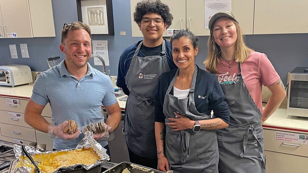 Halff employees from Austin cooking food at Ronald McDonald House Charities