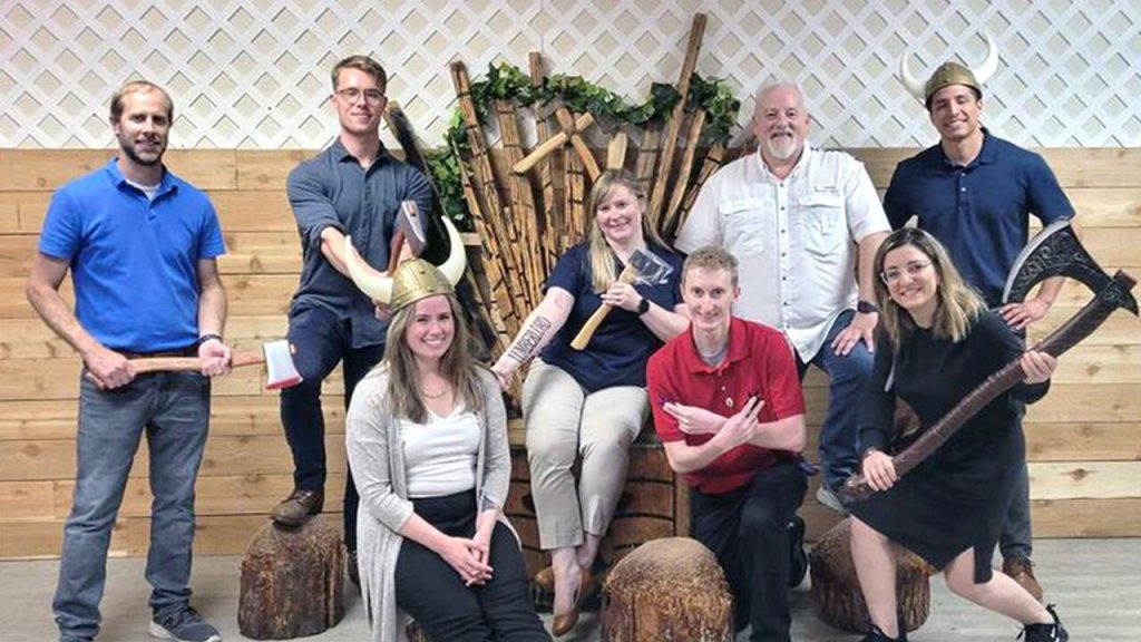 Halff's Water/Wastewater team posing for group photo after axe throwing