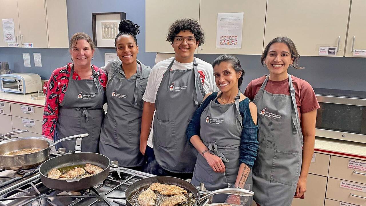 Austin Halff employees volunteering at Ronald McDonald House serving meals