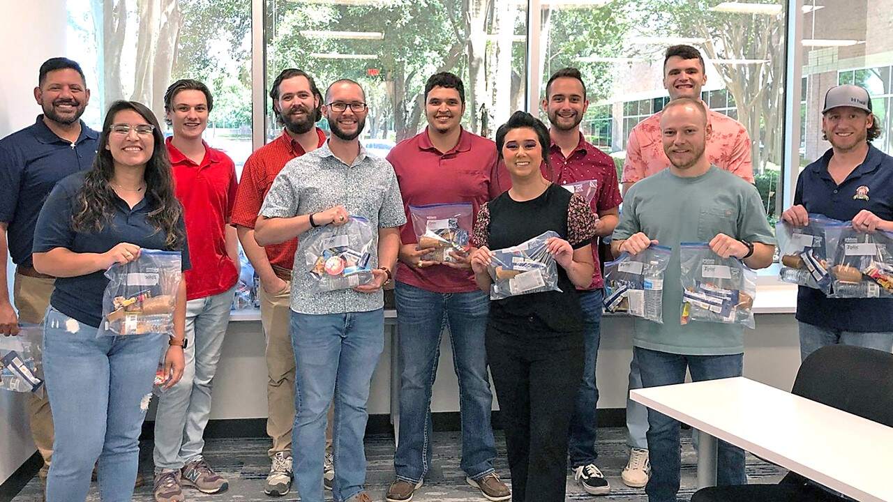 Halff's Austin offices holding kits for Caritas of Austin nonprofit