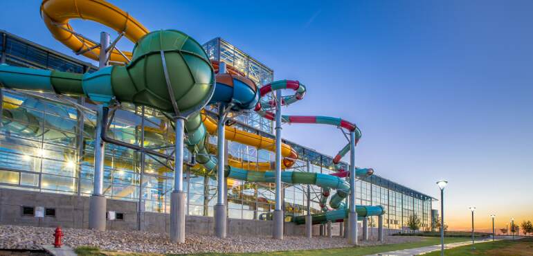 Epic Waters Waterpark waterslides view from the exterior at sunset in Grand Prairie, Texas