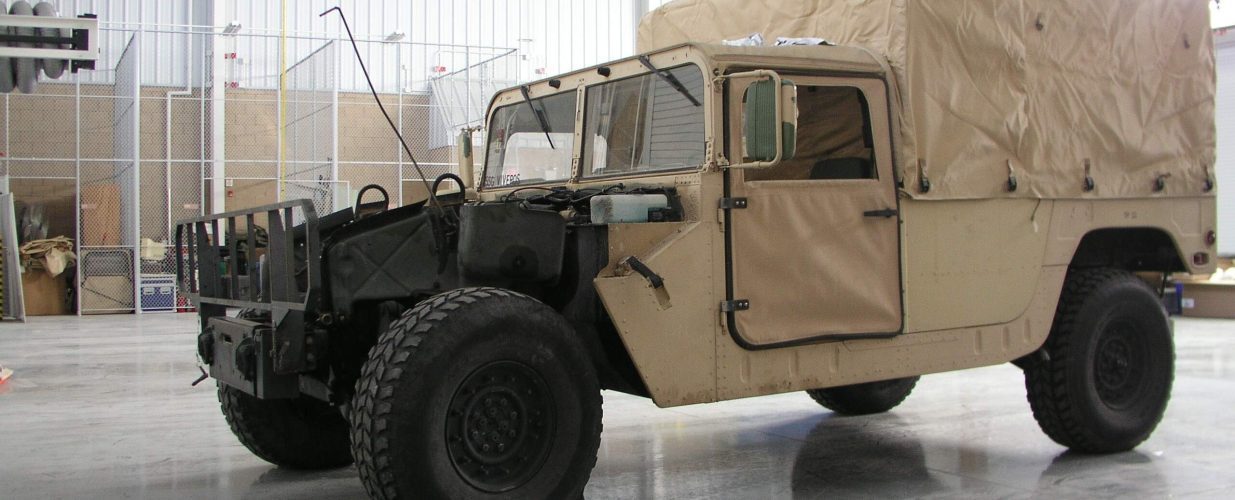 Military truck at Fort Bliss Tactical Equipment shop exterior