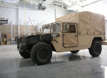Military truck at Fort Bliss Tactical Equipment shop exterior