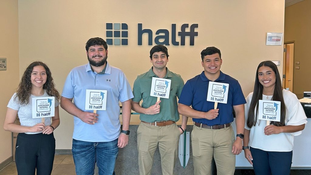 Halff's Summer 2024 McAllen interns holding up signs for photo