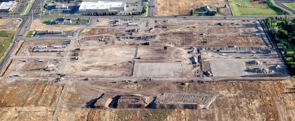 An aerial view of a large brownfield land development area